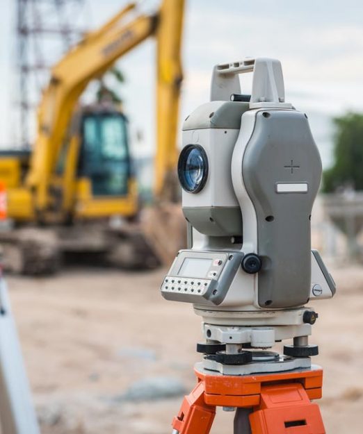 Gray surveying equipment at a constuction site