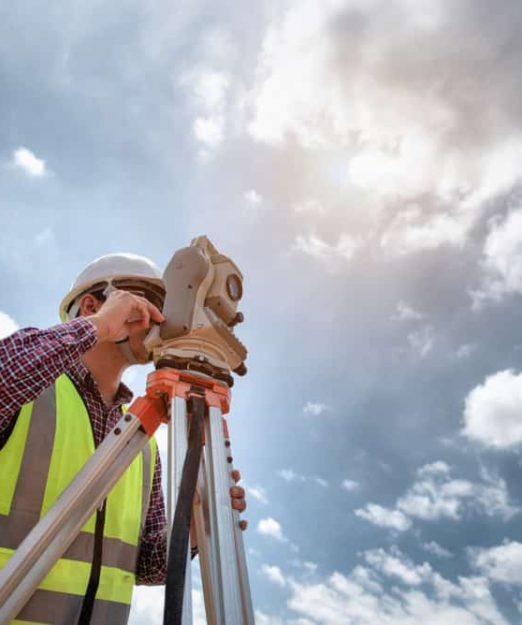 Surveying Land With Survey Equipment