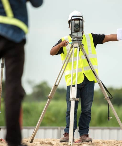 Surveyor Working on Site — Premium Pegs for Surveying & More in Cessnock, NSW