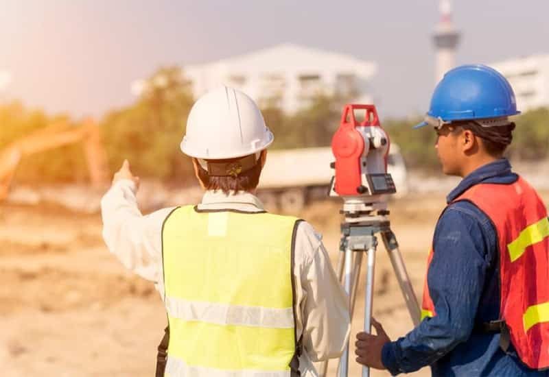 Two Surveyor Inspecting the Location — Premium Pegs for Surveying & More in Heatherbrae, NSW